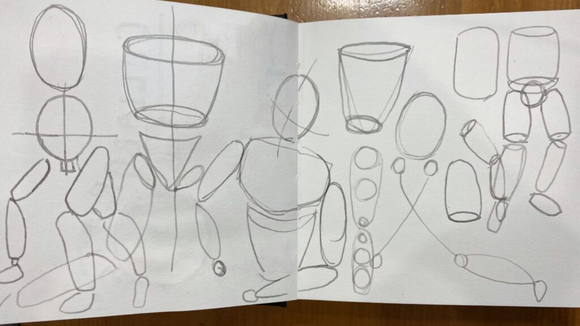 A sketchbook open to pages filled with detailed drawings of various people and objects in different poses and styles.