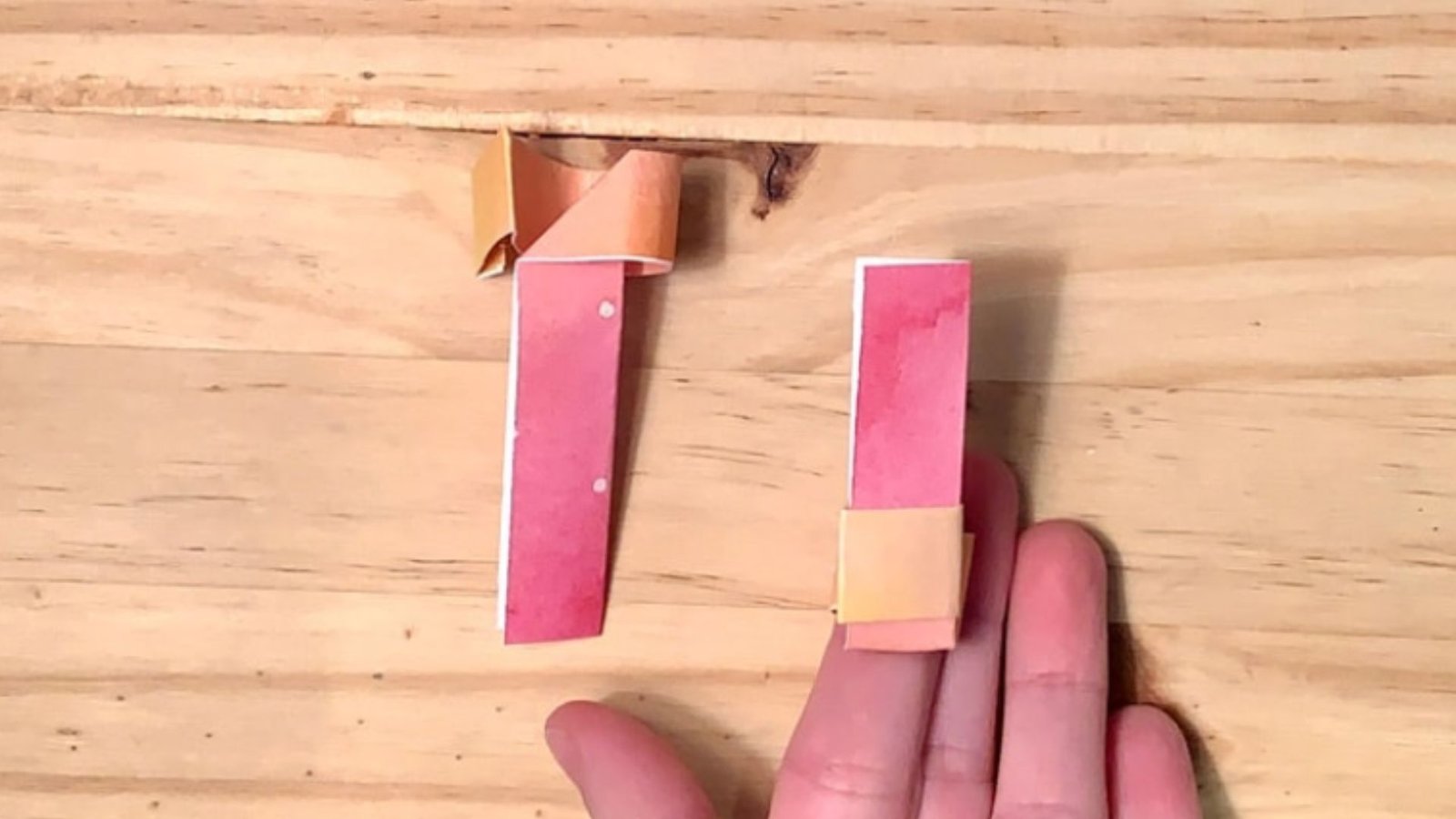 Illustrated instructions for making a classic paper airplane from a sheet of paper.