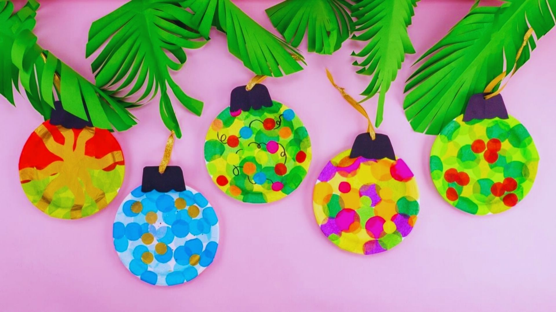 Colorful Christmas ornaments crafted from decorated paper plates, showcasing festive designs and holiday spirit.
