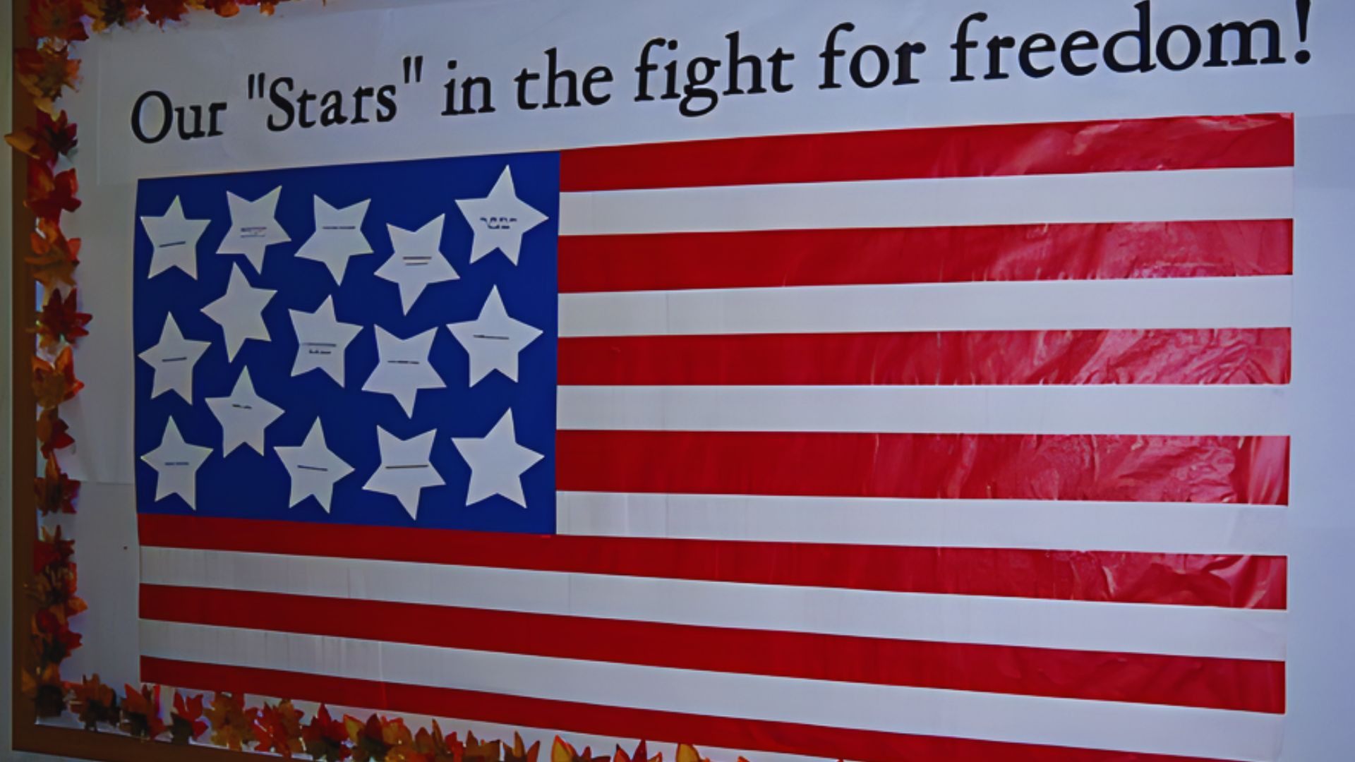 Bulletin board featuring an American flag and the phrase "Our Stars in the Fight for Freedom."