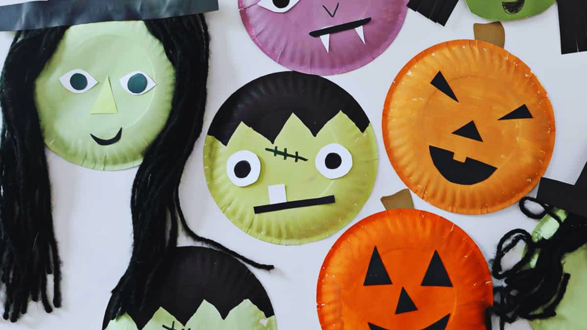 Colorful Halloween-themed paper plate craft for kids, featuring spooky designs and fun decorations.