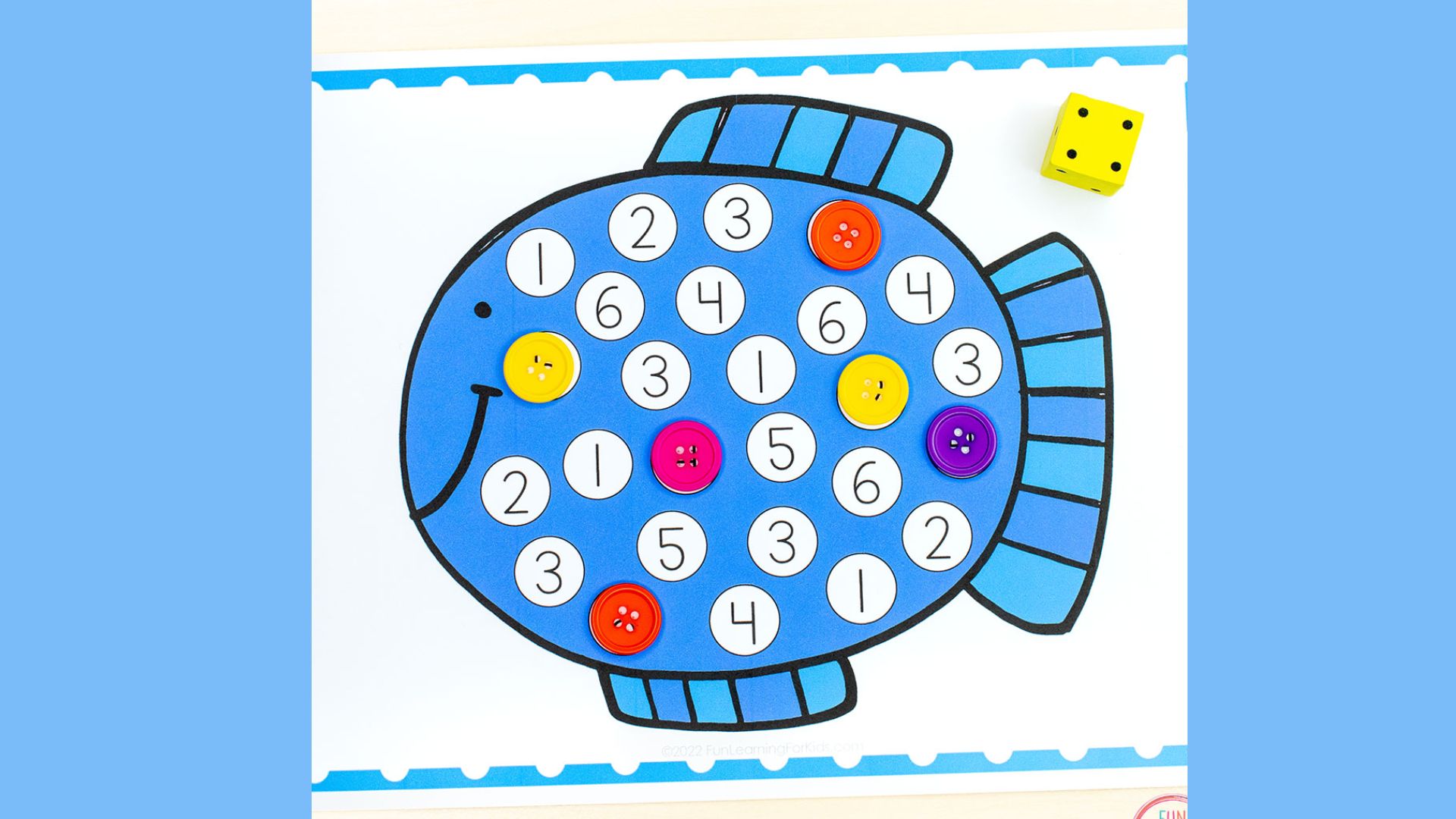 A colorful fish counting game featuring dice and numbered cards for educational play.