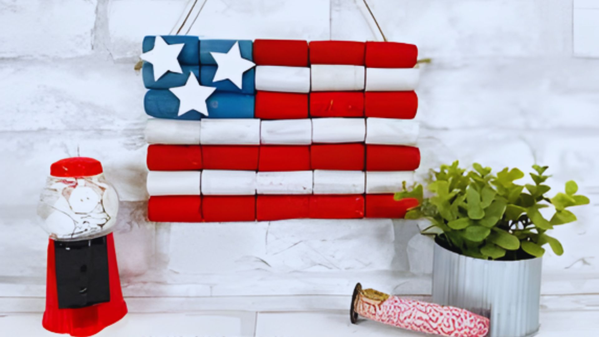 American flag wall hanging crafted with colorful materials, perfect for kids' creative projects and patriotic decor.