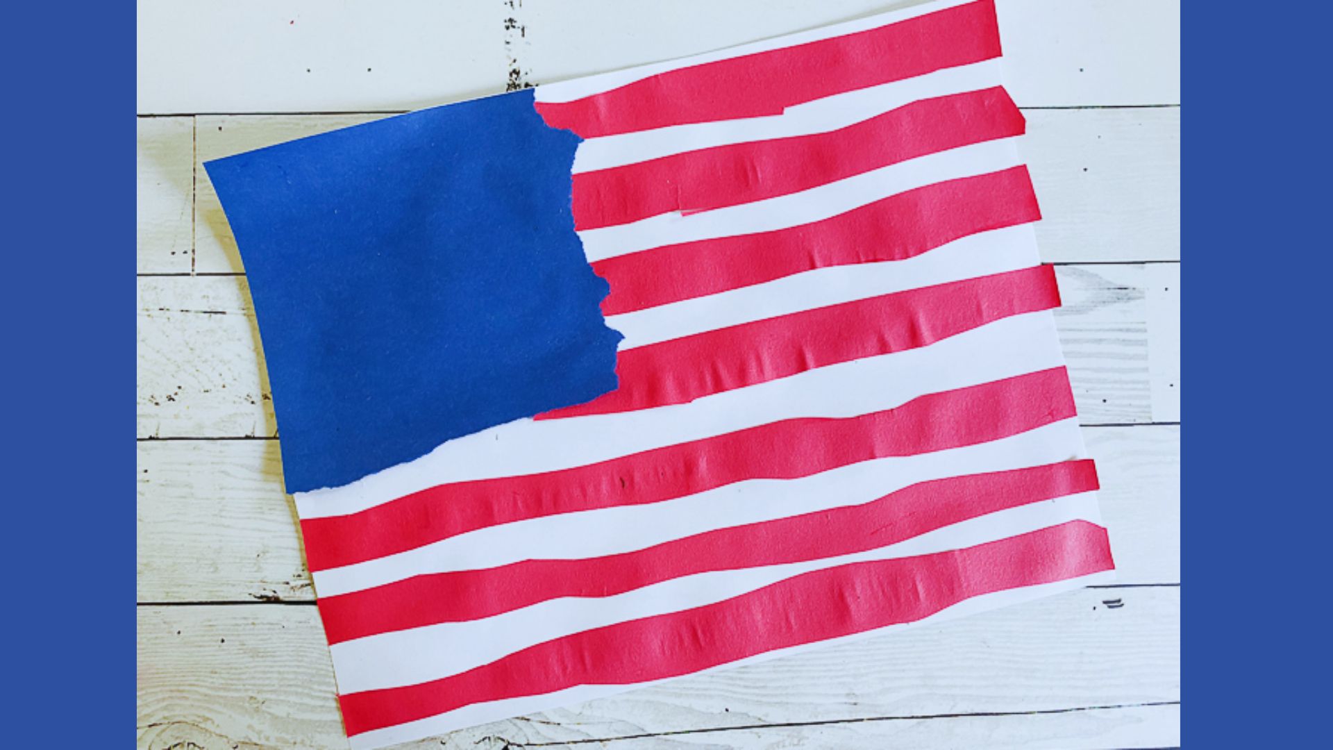Torn paper craft of an American flag featuring a red, white, and blue pattern, symbolizing patriotism and creativity.