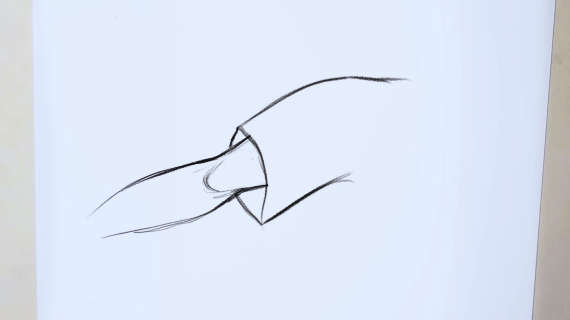 A drawing of a hand gripping a knife, showcasing the hand's details and the knife's blade.