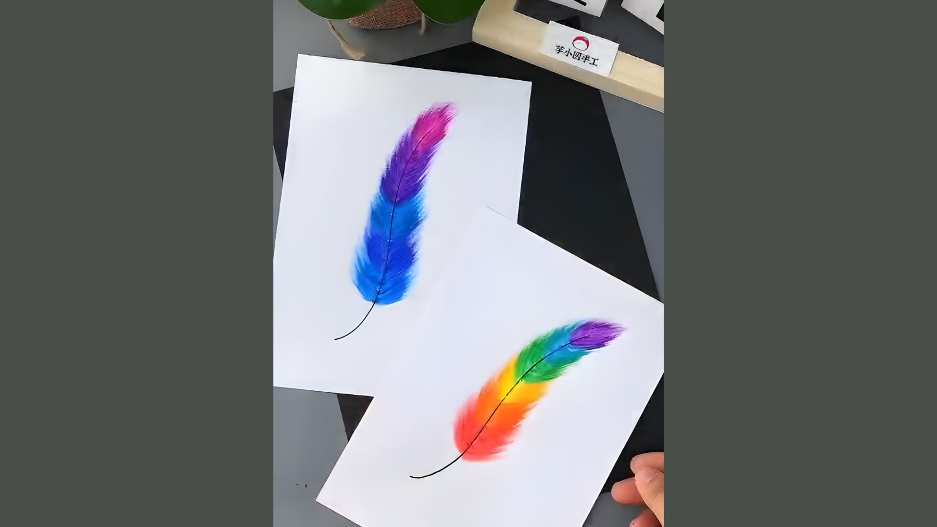 Two cards featuring a vibrant rainbow feather design, showcasing colorful patterns and textures.