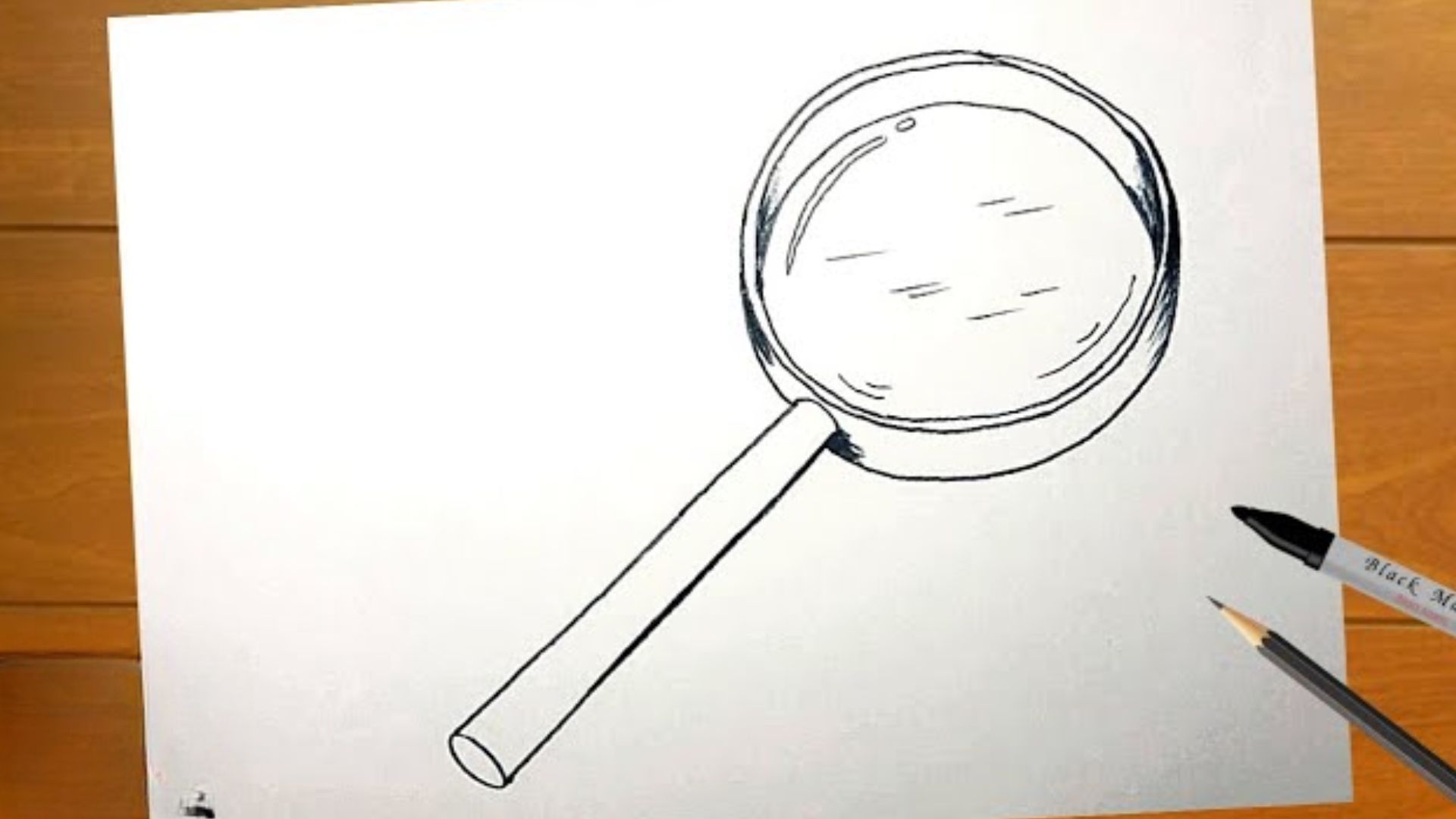 Step-by-step guide illustrating how to draw a magnifying glass, featuring clear instructions and visual examples.