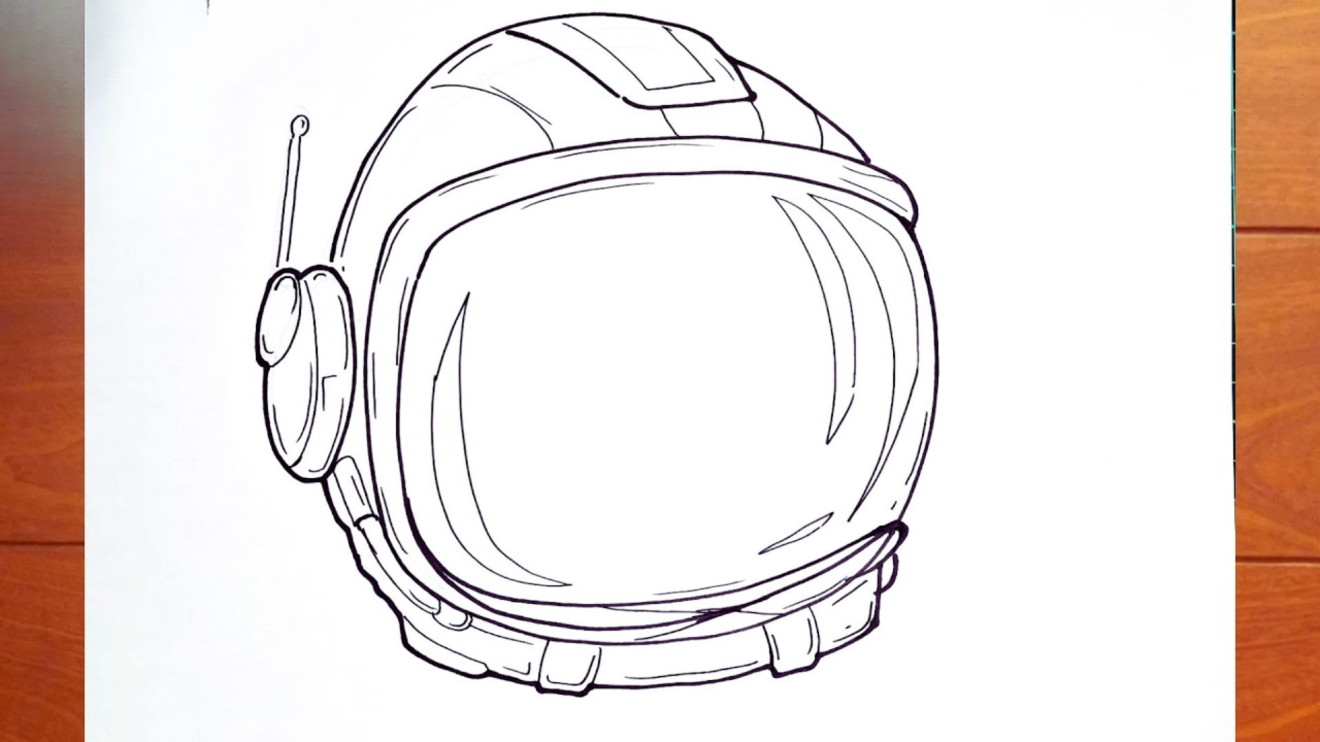 A drawing of an astronaut helmet resting on a wooden table, showcasing intricate details and reflections.