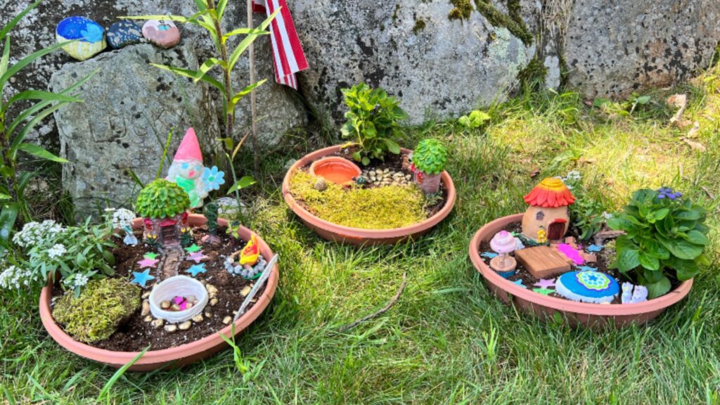 Three green felt peas nestled in a handmade pod, showcasing a whimsical craft project for children.