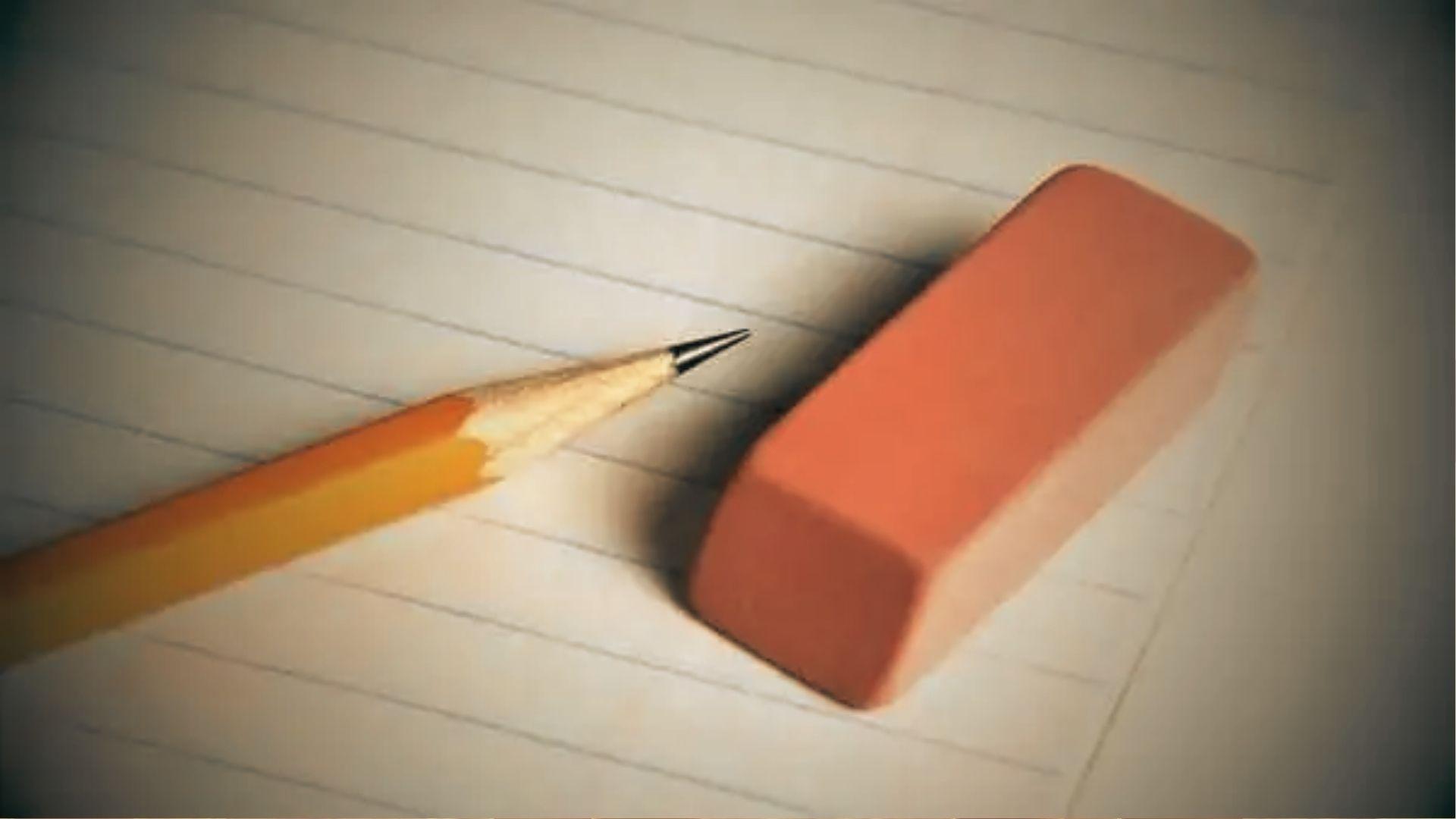 Photo of a sharpened yellow pencil and pink eraser on lined notebook paper.