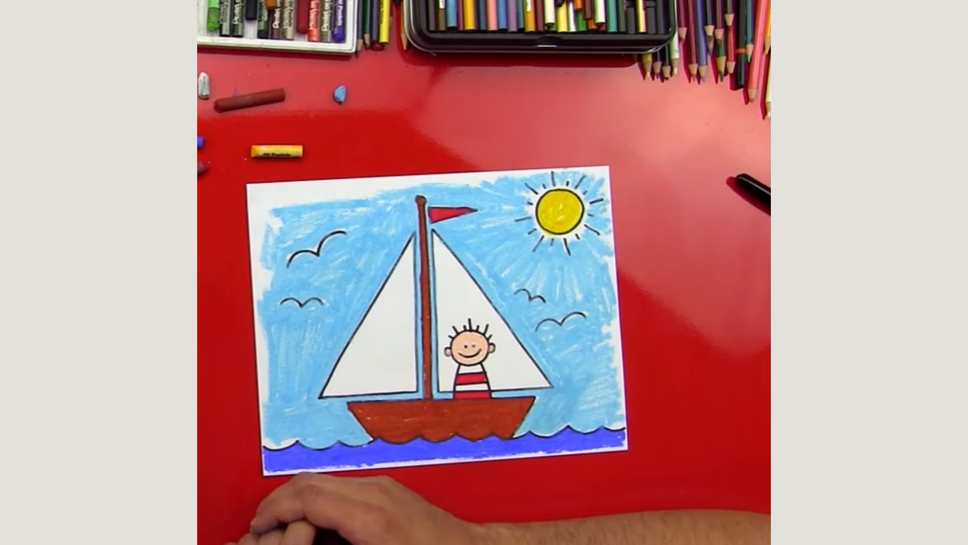 "A colorful drawing of a sailboat with a child joyfully holding a crayon, capturing a moment of creativity and imagination."