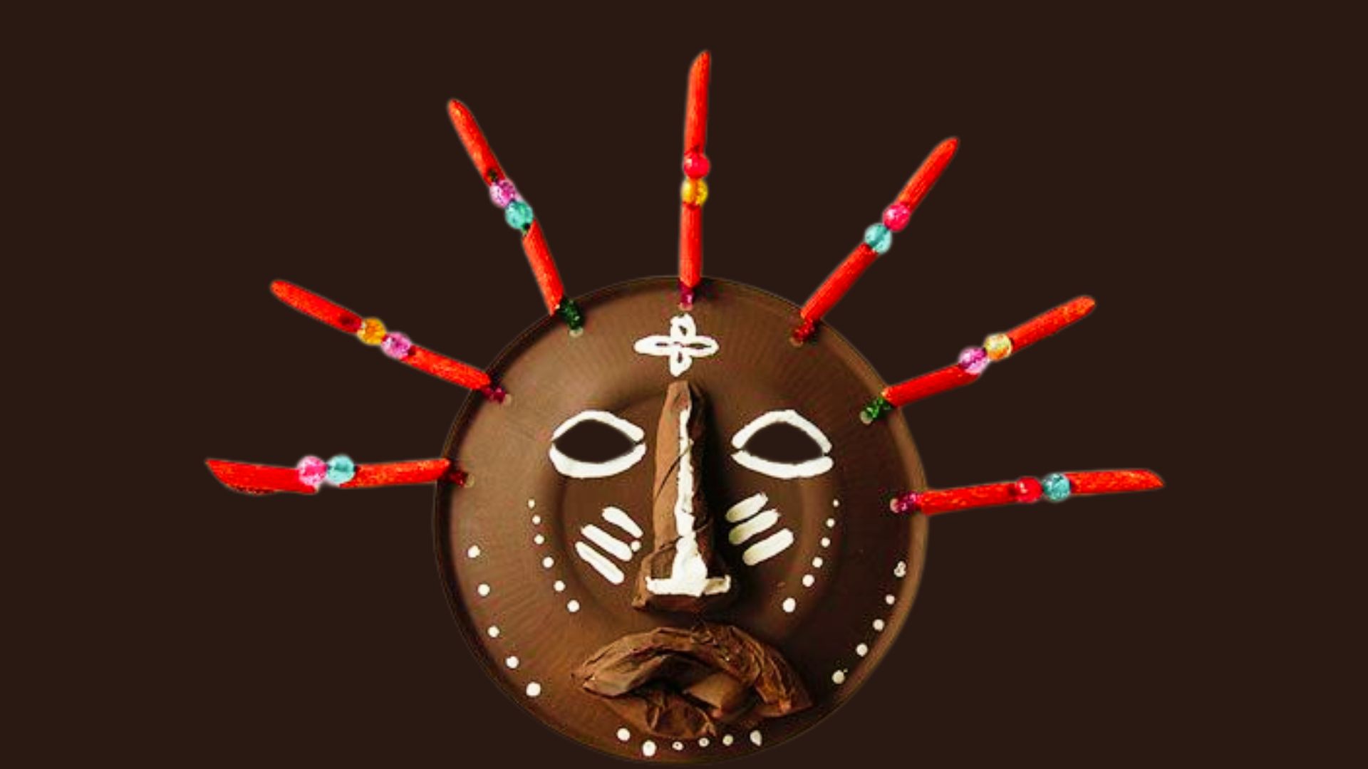 A chocolate mask featuring a painted face, inspired by African mask drawing ideas for beginners.