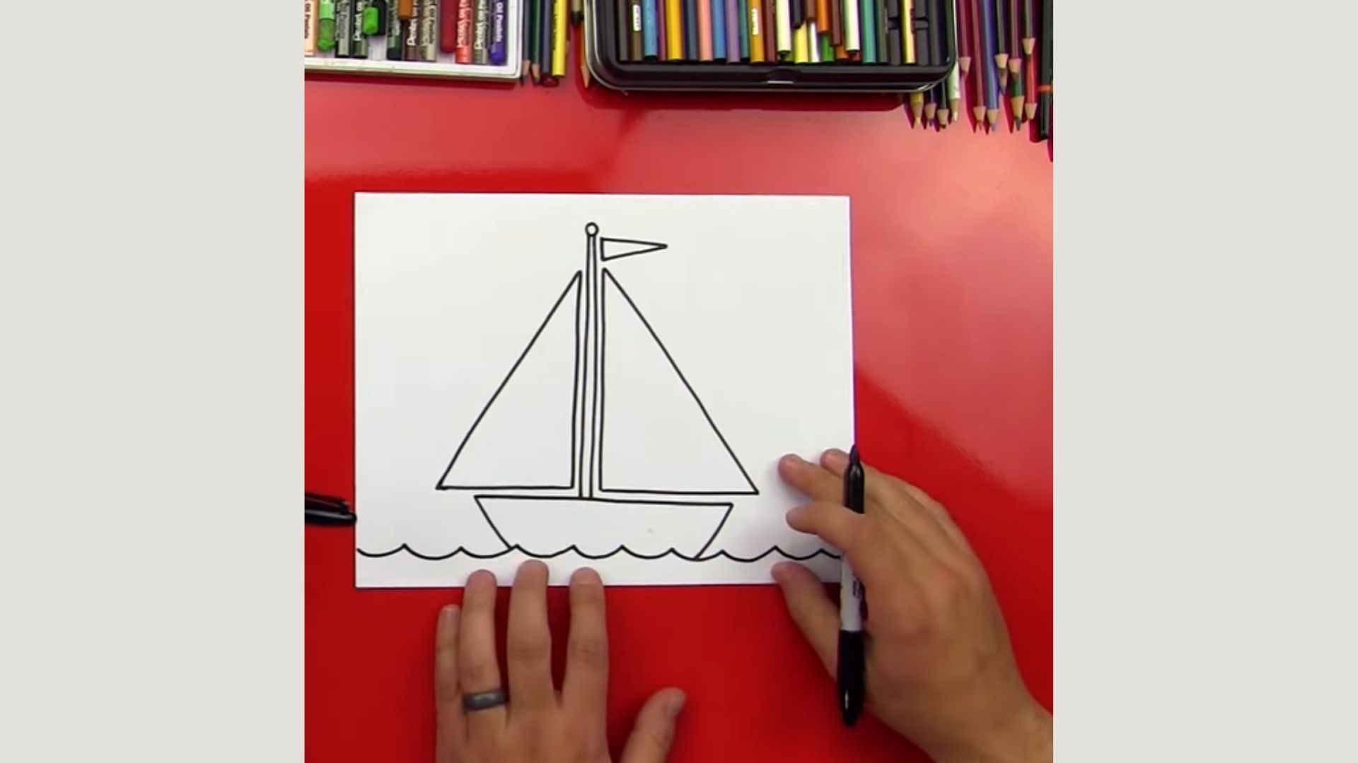 "Instructional image showing the process of drawing a sailboat, with detailed steps and helpful visual cues."