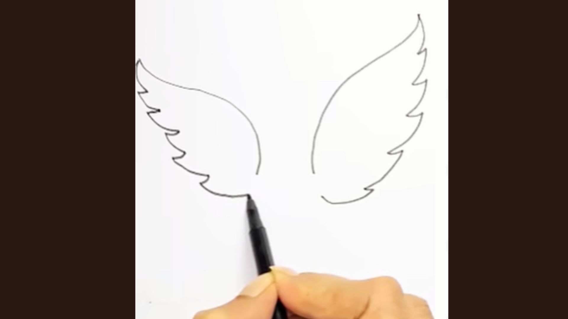 Angel wings with inner curved lines added inside both wing shapes.