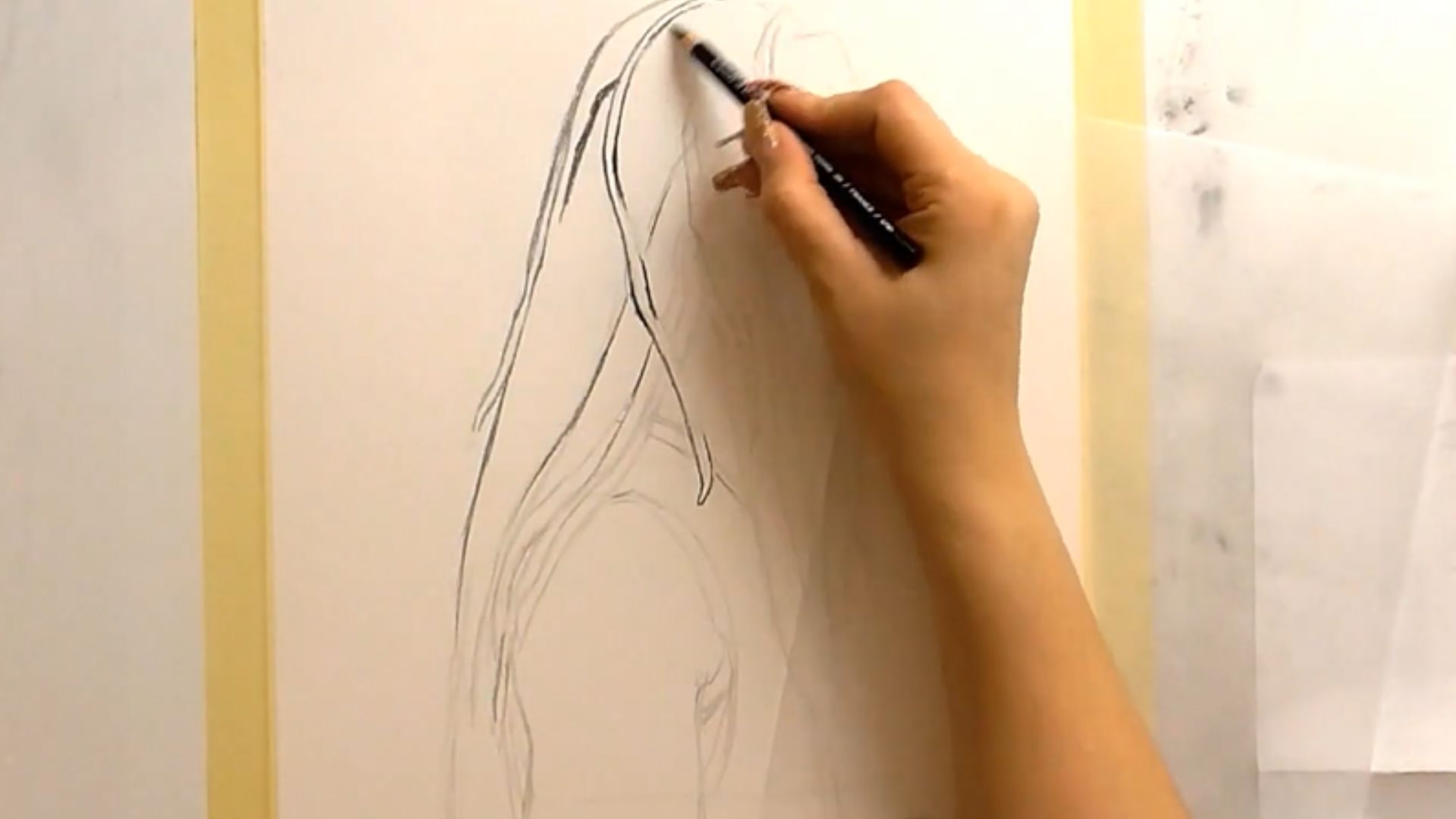 "Visual tutorial on drawing a woman's head in pencil, focusing on facial structure and shading techniques for realism."
