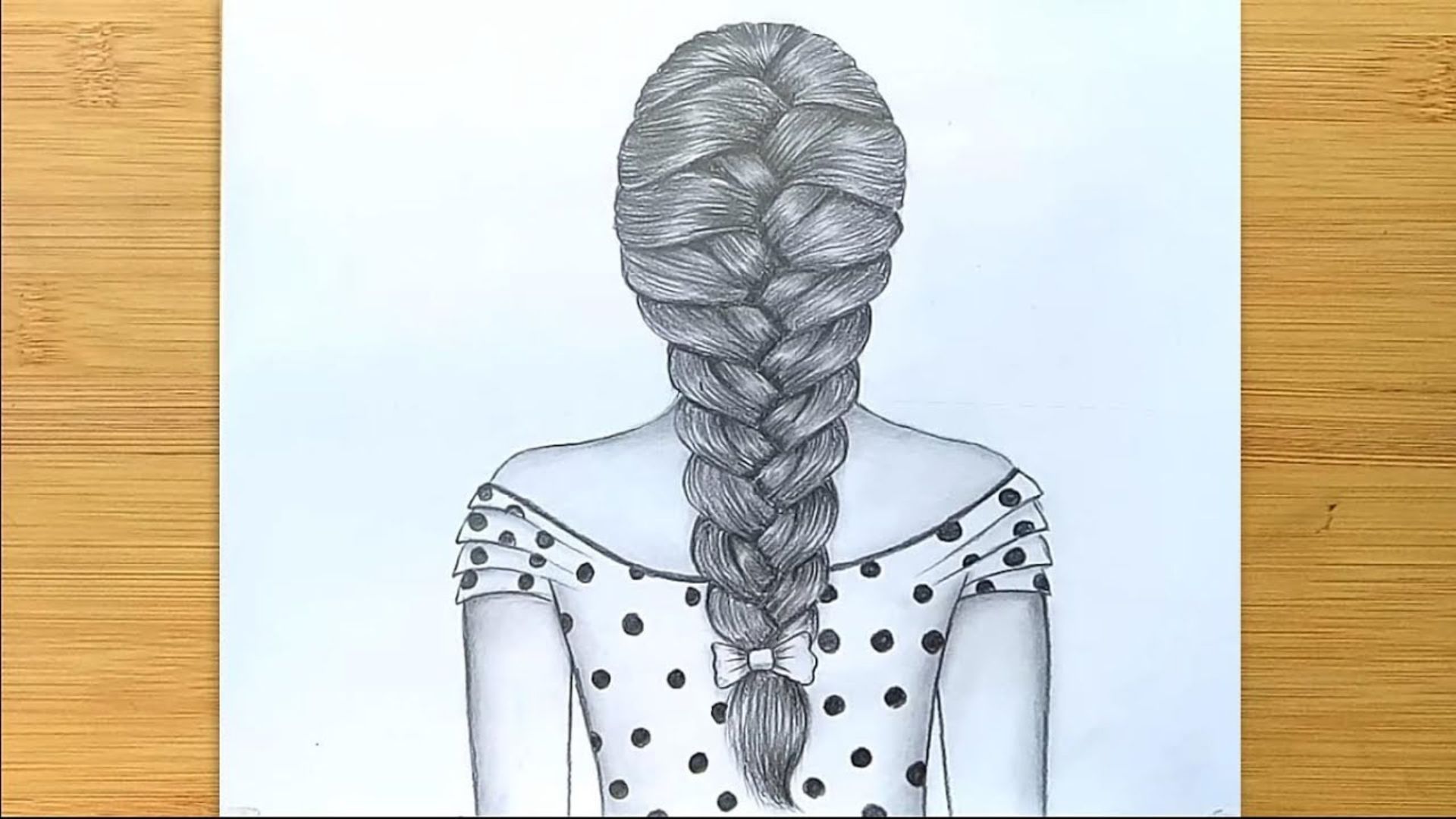 A drawing of a girl with a braid in her hair, showcasing her vibrant clothing.
