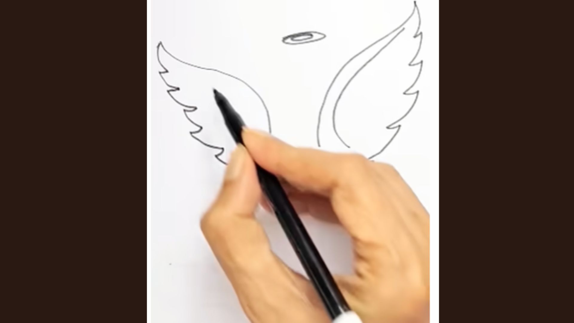 Feather details added on both angel wings using curved and zigzag lines.