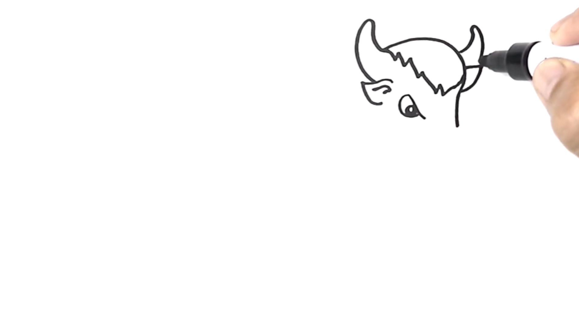 "A hand using a marker to draw a detailed head on paper."