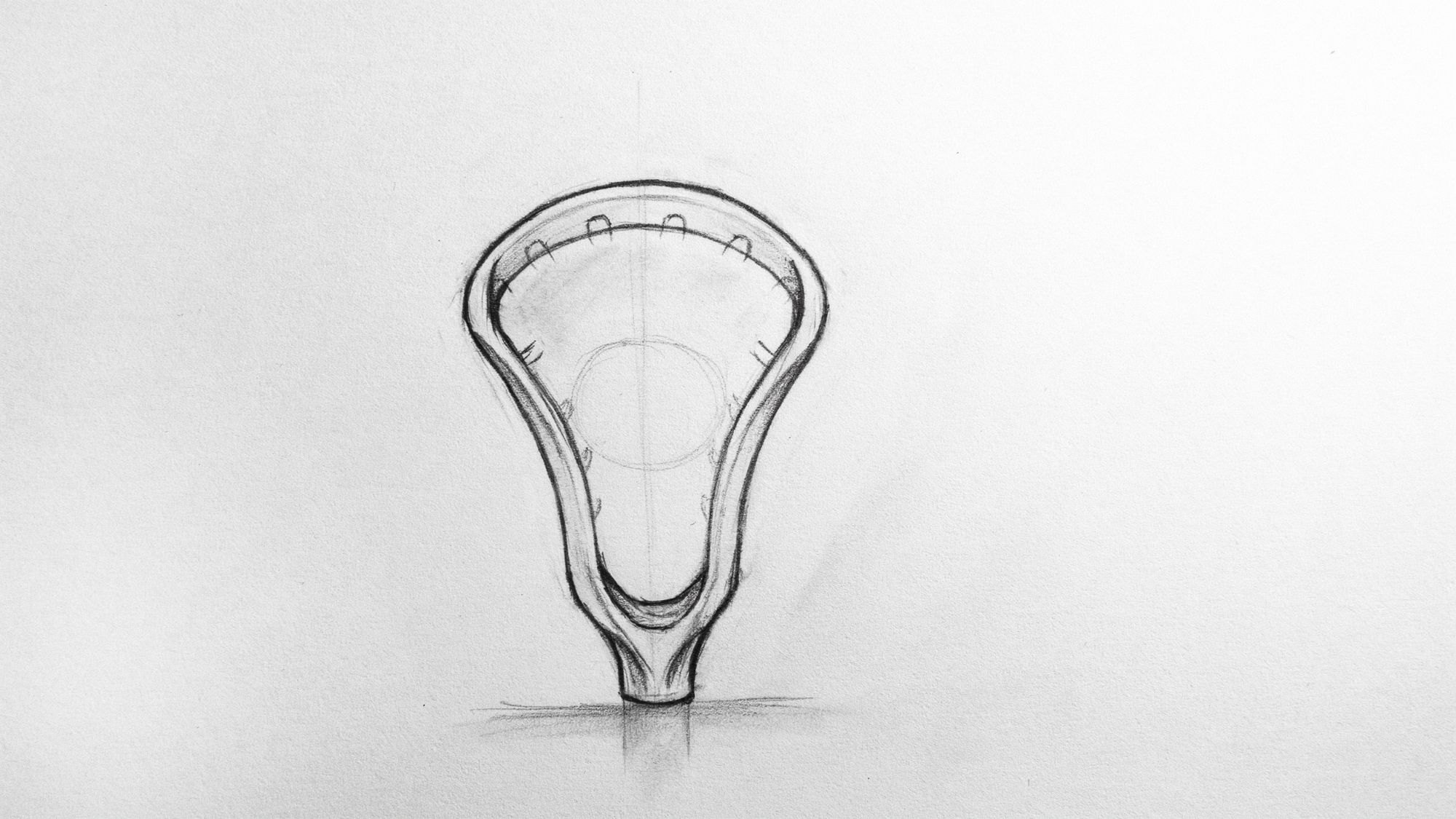 Pencil sketch showing the head shape of a lacrosse stick drawing.