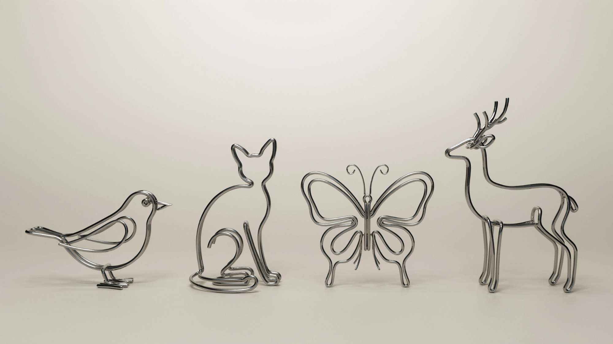 Small wire sculptures shaped like animals including bird, cat, butterfly, and deer