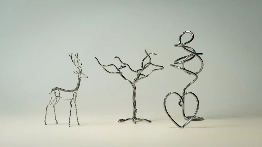 7 Wire Sculpture Ideas to Try at Home Collection of silver wire sculptures including tree, heart, animal, and abstract shapes displayed in a clean studio setup