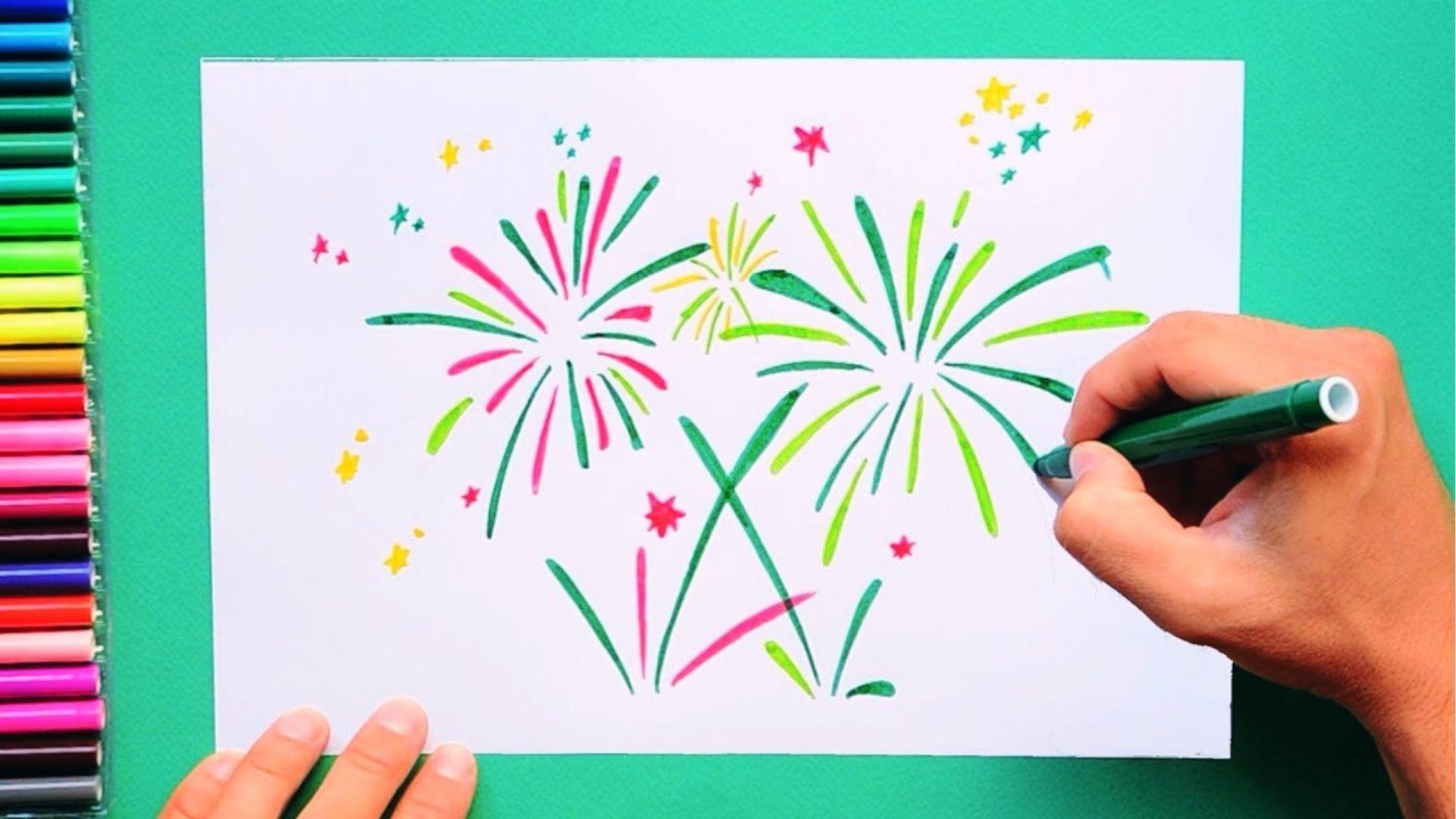 Hand uses green marker to draw fireworks bursts and stars on paper with markers lined up