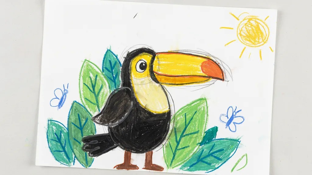 A colored toucan drawing on paper with black body and bright beak, surrounded by simple green leaves, showing a fun and complete beginner artwork.