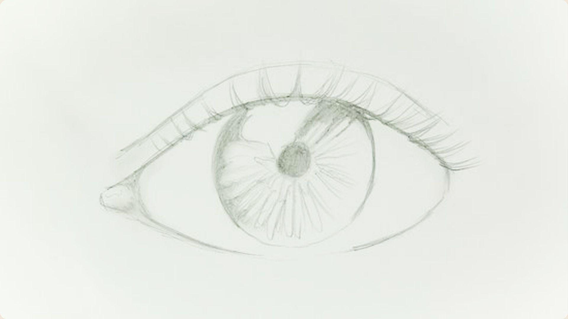 Light pencil sketch of an eye with detailed iris shading and basic upper eyelashes.